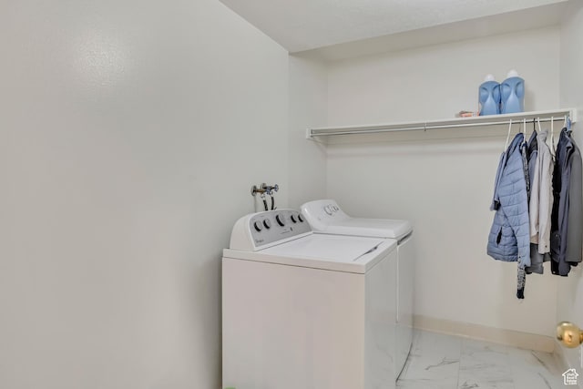 4564 S Early Duke St, West Valley City, UT 84120 - laundry area with washer and dryer, marble finish floors, and baseboards