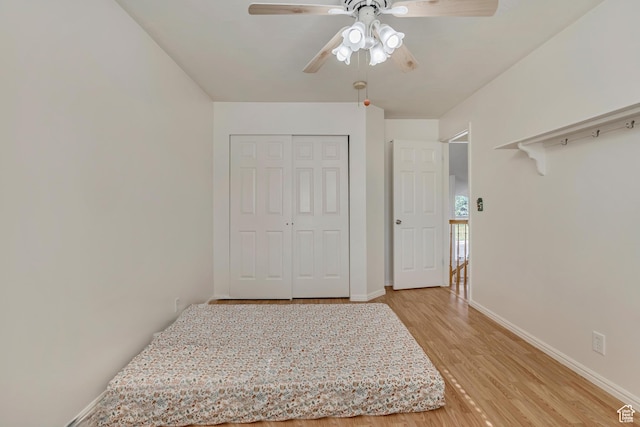 4564 S Early Duke St, West Valley City, UT 84120 - bedroom with light wood-style floors, baseboards, a closet, and a ceiling fan