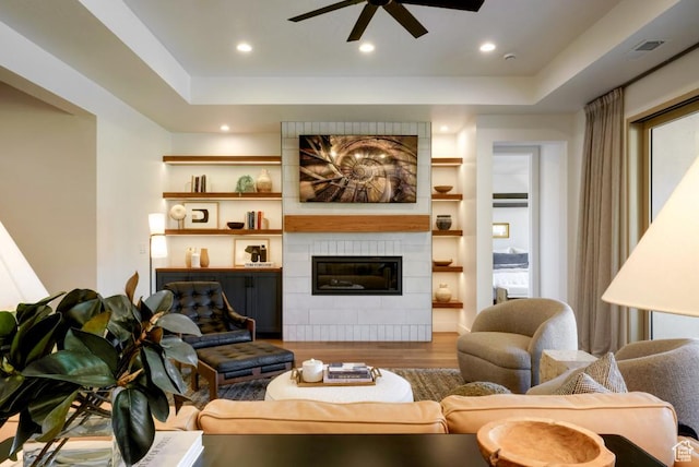 1367 N Daylight St Unit 16, Washington, UT 84780 - living room with wood finished floors, ceiling fan, a fireplace, recessed lighting, and a raised ceiling