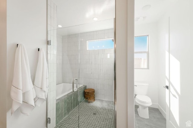1367 N Daylight St Unit 16, Washington, UT 84780 - full bathroom featuring toilet, tiled shower, a relaxing tiled tub, and tile patterned flooring