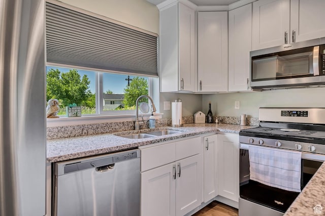 453 N Cattail Dr E, Ogden, UT 84404 - kitchen featuring appliances with stainless steel finishes, a sink, plenty of natural light, and white cabinets