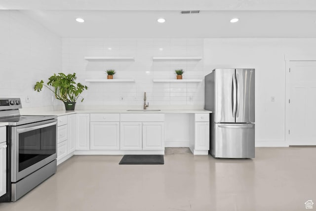 9447 N Arrowhead Dr, Eagle Mountain, UT 84005 - kitchen featuring appliances with stainless steel finishes, a sink, open shelves, finished concrete floors, and white cabinetry