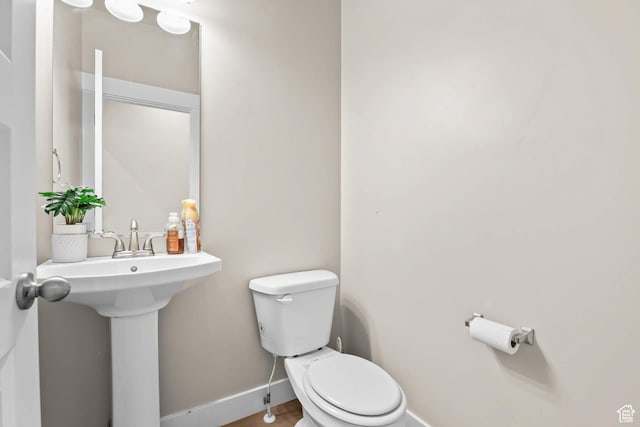 9447 N Arrowhead Dr, Eagle Mountain, UT 84005 - half bathroom featuring toilet and baseboards