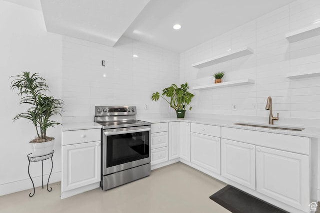 9447 N Arrowhead Dr, Eagle Mountain, UT 84005 - kitchen featuring stainless steel electric stove, a sink, backsplash, light countertops, and open shelves