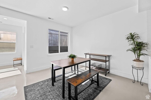 9447 N Arrowhead Dr, Eagle Mountain, UT 84005 - dining space with concrete flooring and baseboards