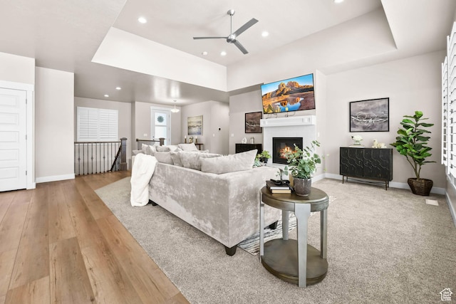 9447 N Arrowhead Dr, Eagle Mountain, UT 84005 - living room with a ceiling fan, recessed lighting, baseboards, wood-type flooring, and a glass covered fireplace