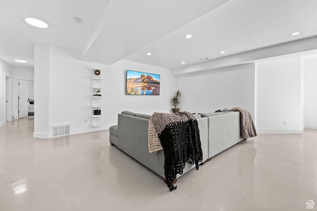 9447 N Arrowhead Dr, Eagle Mountain, UT 84005 - living area with finished concrete floors, recessed lighting, and baseboards