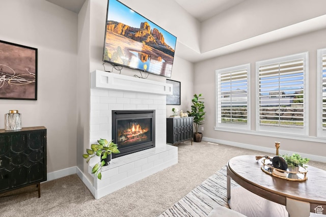 9447 N Arrowhead Dr, Eagle Mountain, UT 84005 - carpeted living area featuring a brick fireplace and baseboards