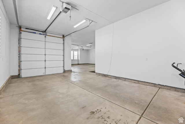 9447 N Arrowhead Dr, Eagle Mountain, UT 84005 - garage with a garage door opener and baseboards