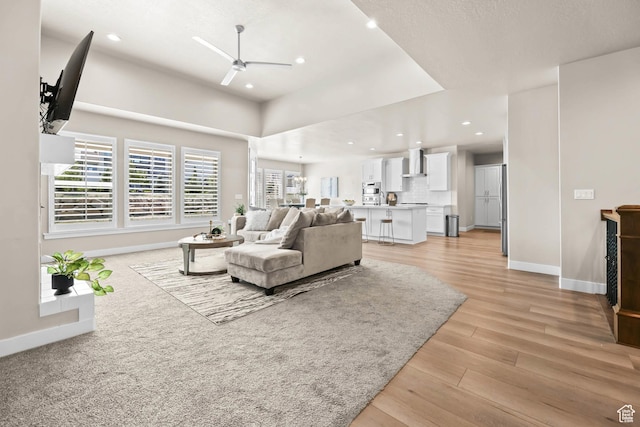 9447 N Arrowhead Dr, Eagle Mountain, UT 84005 - living room featuring a ceiling fan, baseboards, light wood-style flooring, and recessed lighting