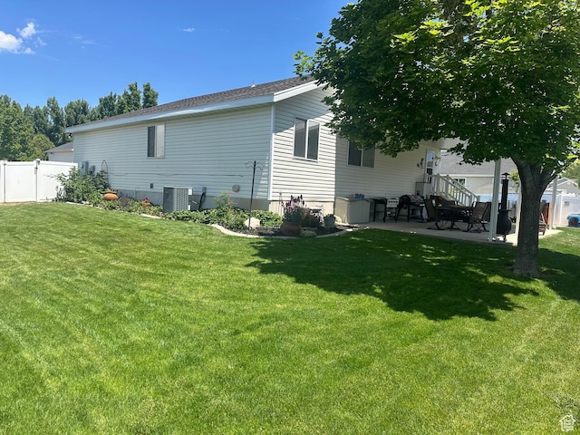 3863 W Augusta Dr S, Syracuse, UT 84075 - back of house featuring a patio area and central AC