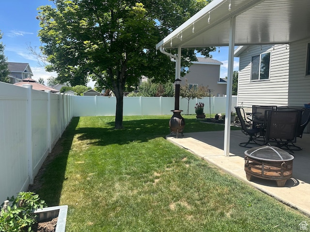 3863 W Augusta Dr S, Syracuse, UT 84075 - view of yard featuring a patio area and a fire pit