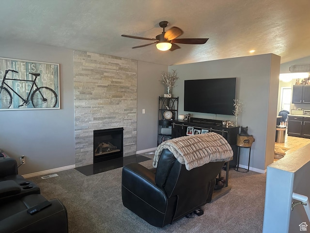 3863 W Augusta Dr S, Syracuse, UT 84075 - carpeted living area with ceiling fan, a fireplace, baseboards, and a textured ceiling
