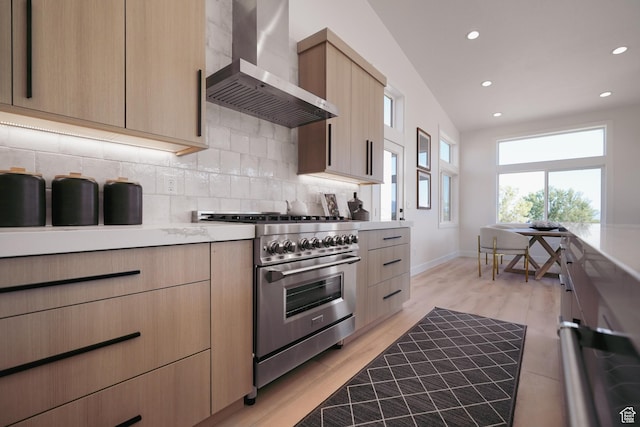 5866 N Fork Rd, Eden, UT 84310 - kitchen with high end stainless steel range, wall chimney exhaust hood, light brown cabinets, decorative backsplash, and recessed lighting