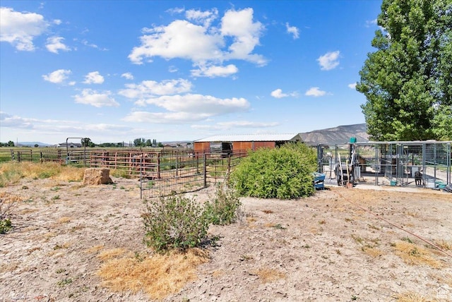 150 N 1015 W, Manti, UT 84642 - view of yard featuring an outdoor structure, an exterior structure, and a view of countryside