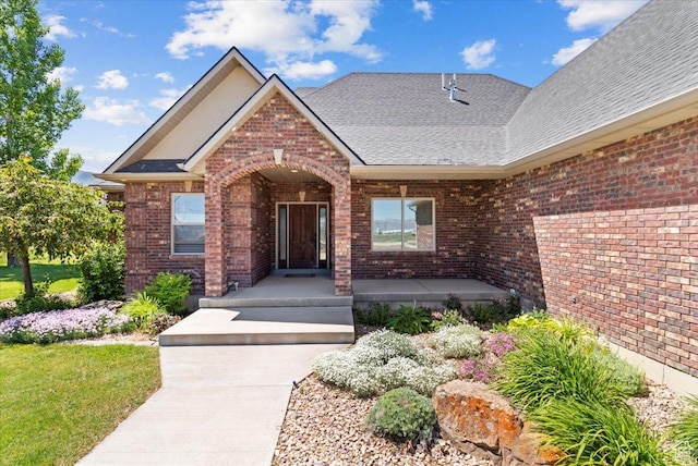 150 N 1015 W, Manti, UT 84642 - entrance to property with covered porch, brick siding, and roof with shingles