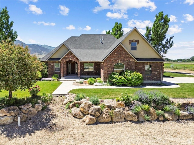 150 N 1015 W, Manti, UT 84642 - view of front of home with brick siding, a front lawn, and a mountain view