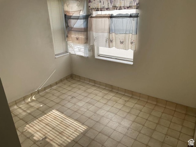 133 W Forest St, Brigham City, UT 84302 - tiled spare room with baseboards