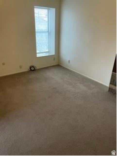 133 W Forest St, Brigham City, UT 84302 - carpeted spare room with baseboards