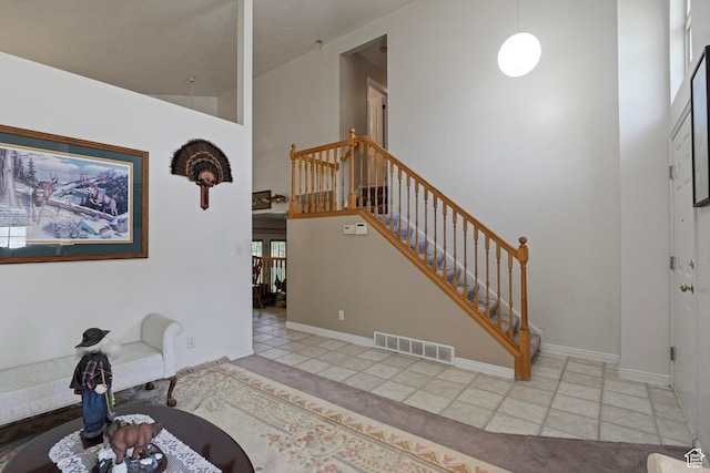 1767 E 2825 N, Layton, UT 84040 - foyer entrance featuring tile patterned floors, stairway, a towering ceiling, and baseboards