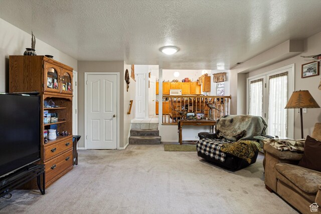 1767 E 2825 N, Layton, UT 84040 - living area with light colored carpet, a textured ceiling, and stairs