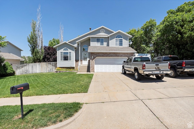 1767 E 2825 N, Layton, UT 84040 - view of front of property with driveway, an attached garage, and brick siding