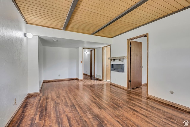 1063 Oxford Dr, Ogden, UT 84403 - empty room with wooden ceiling with exposed beams, wood finished floors, and baseboards