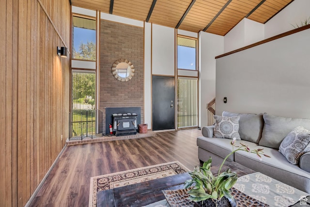 1063 Oxford Dr, Ogden, UT 84403 - living area featuring high vaulted ceiling, wood ceiling with exposed beams, wood finished floors, and wood walls