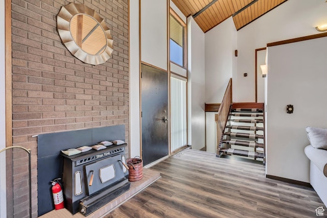 1063 Oxford Dr, Ogden, UT 84403 - foyer entrance featuring wooden ceiling, wood finished floors, stairs, high vaulted ceiling, and baseboards