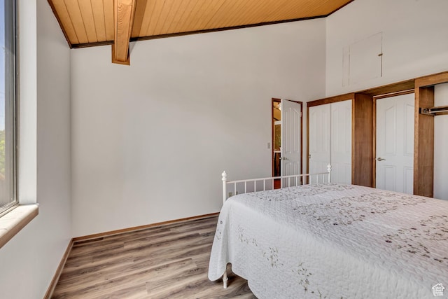 1063 Oxford Dr, Ogden, UT 84403 - bedroom featuring wooden ceiling, light wood finished floors, and baseboards