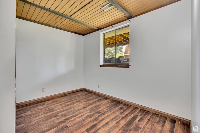 1063 Oxford Dr, Ogden, UT 84403 - spare room featuring wood finished floors, baseboards, and wooden ceiling with exposed beams