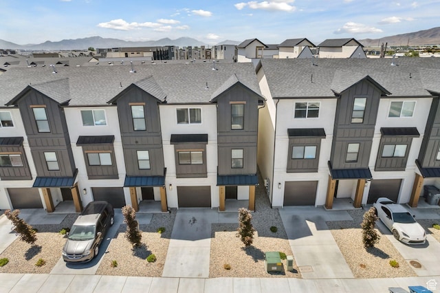 622 E 340 S, American Fork, UT 84003 - townhome / multi-family property with a garage, a standing seam roof, driveway, and a shingled roof