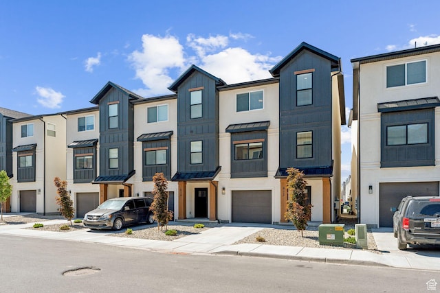 622 E 340 S, American Fork, UT 84003 - townhome / multi-family property featuring a standing seam roof, an attached garage, driveway, and metal roof