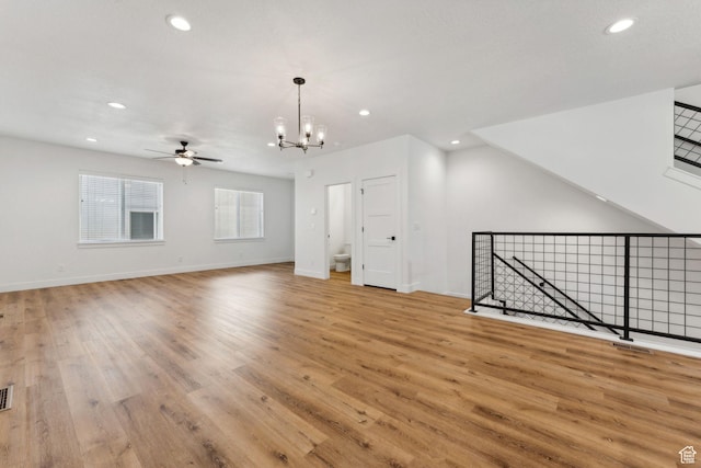 622 E 340 S, American Fork, UT 84003 - unfurnished living room with ceiling fan, a chandelier, light wood-style flooring, recessed lighting, and baseboards