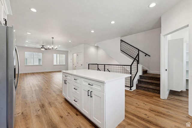 622 E 340 S, American Fork, UT 84003 - kitchen with freestanding refrigerator, open floor plan, light wood-type flooring, a chandelier, and white cabinetry