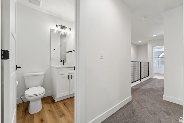 622 E 340 S, American Fork, UT 84003 - bathroom featuring vanity, toilet, baseboards, recessed lighting, and wood finished floors