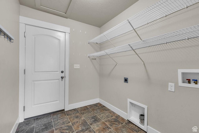 1848 W 645 S, Orem, UT 84059 - laundry area featuring electric dryer hookup, washer hookup, baseboards, dark stone finish flooring, and attic access