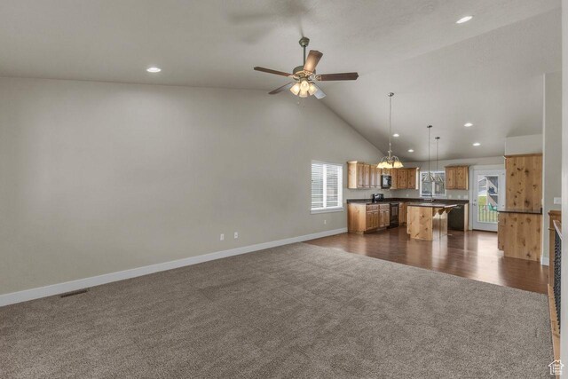 1848 W 645 S, Orem, UT 84059 - kitchen with dark carpet, open floor plan, dark countertops, recessed lighting, and ceiling fan