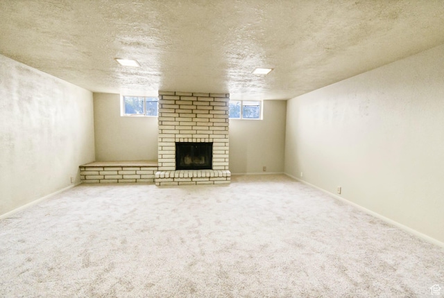 162 E 200 N, Monroe, UT 84754 - basement featuring a brick fireplace, a textured ceiling, and carpet floors