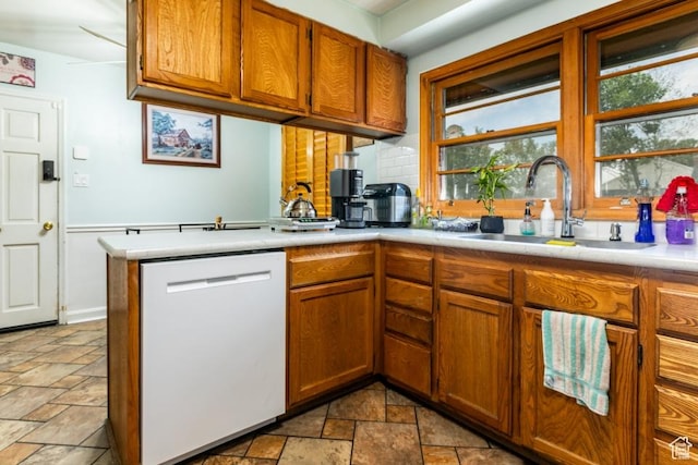 611 E 100 N, Brigham City, UT 84302 - kitchen featuring dishwasher, stone tile floors, plenty of natural light, and light countertops