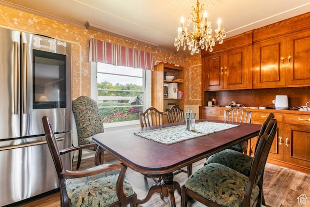 611 E 100 N, Brigham City, UT 84302 - dining room featuring wallpapered walls, a chandelier, wood finished floors, and crown molding