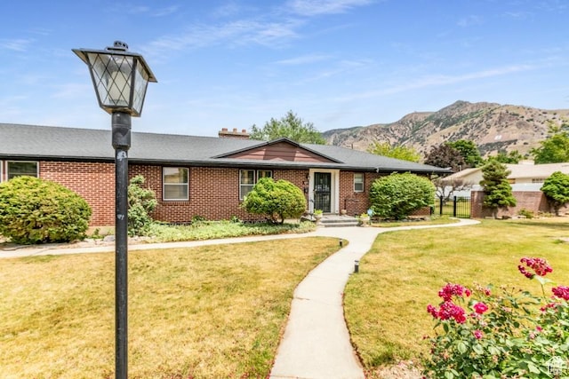 611 E 100 N, Brigham City, UT 84302 - view of front of home with brick siding and a mountain view