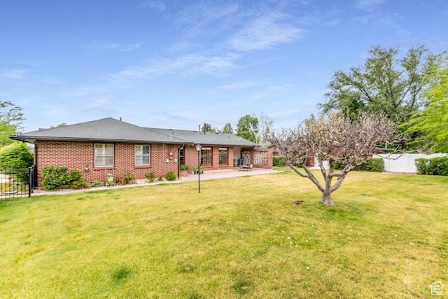 611 E 100 N, Brigham City, UT 84302 - rear view of property featuring a patio area and brick siding