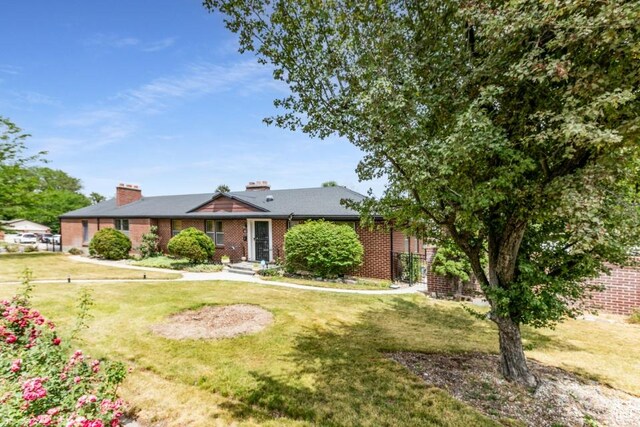 611 E 100 N, Brigham City, UT 84302 - single story home featuring a front yard and brick siding