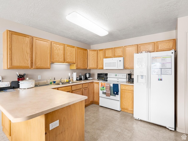 1422 E 1200 S, Provo, UT 84606 - kitchen featuring white appliances, a peninsula, a sink, light countertops, and a textured ceiling