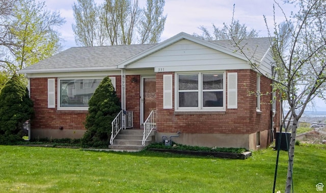 331 W Elberta Dr, Pleasant View, UT 84414 - bungalow with a front lawn, brick siding, central AC, and roof with shingles