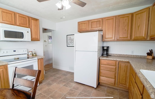 331 W Elberta Dr, Pleasant View, UT 84414 - kitchen featuring white appliances, ceiling fan, light countertops, stone finish flooring, and a sink