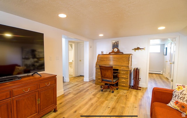 331 W Elberta Dr, Pleasant View, UT 84414 - home office featuring baseboard heating, light wood finished floors, baseboards, recessed lighting, and a textured ceiling