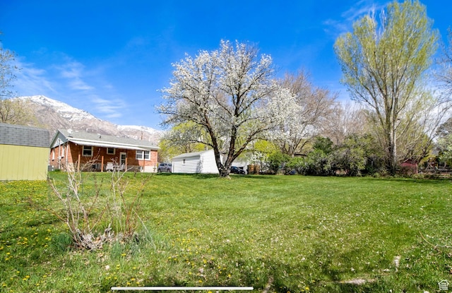 331 W Elberta Dr, Pleasant View, UT 84414 - view of grassy yard with a mountain view