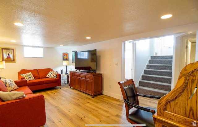 331 W Elberta Dr, Pleasant View, UT 84414 - living room featuring light wood finished floors, stairway, recessed lighting, and a textured ceiling